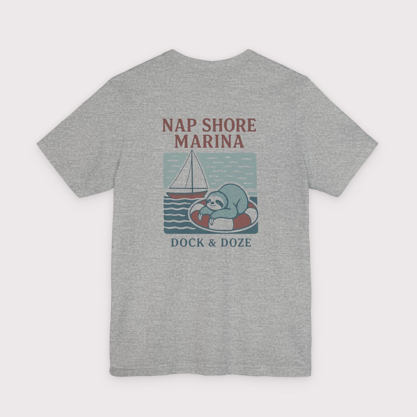 Gray t-shirt with 'Nap Shore Marina' and sloth graphic on a white background