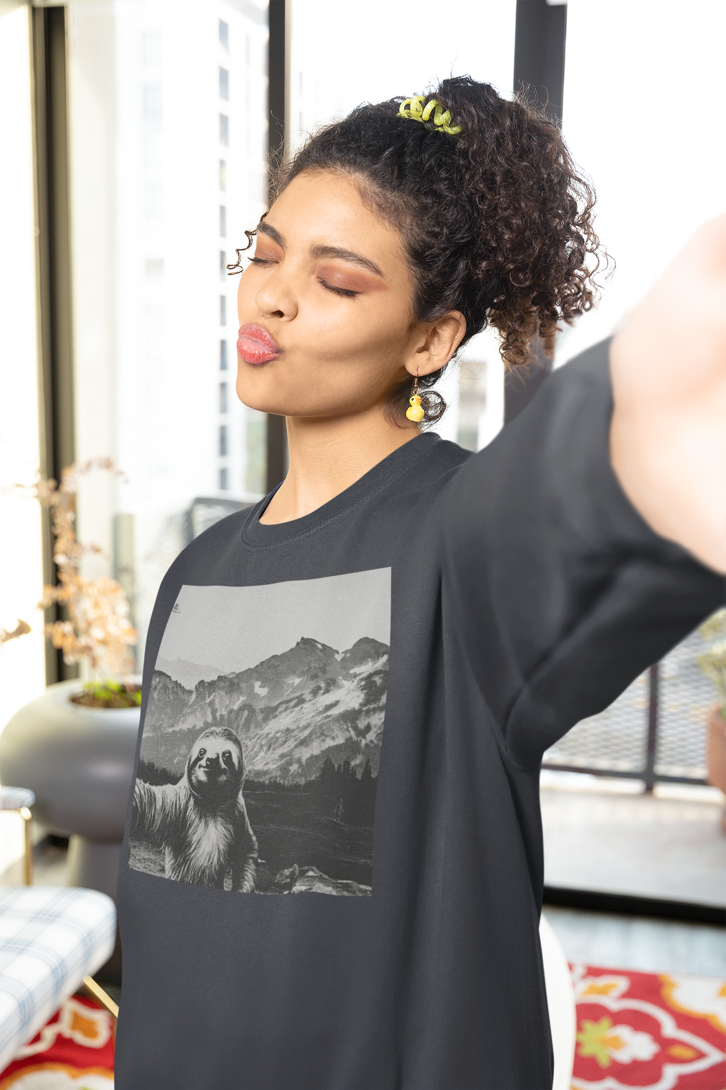 Selfie-ception! Rocking the mountain sloth selfie sweatshirt while snapping her own.